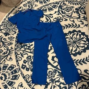 Royal blue scrubs. Purple label yoga size XS.
